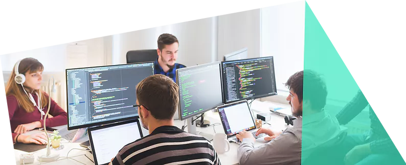 Team working at desks with code on their monitors