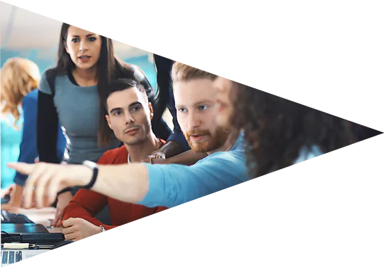 Colleagues gathered around a screen
