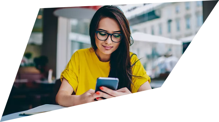 Woman checking her phone at a table